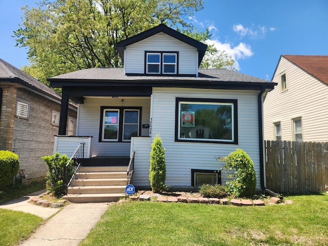 12416 S Carpenter St, Calumet Park, IL 60827 - bungalow featuring covered porch and roof with shingles