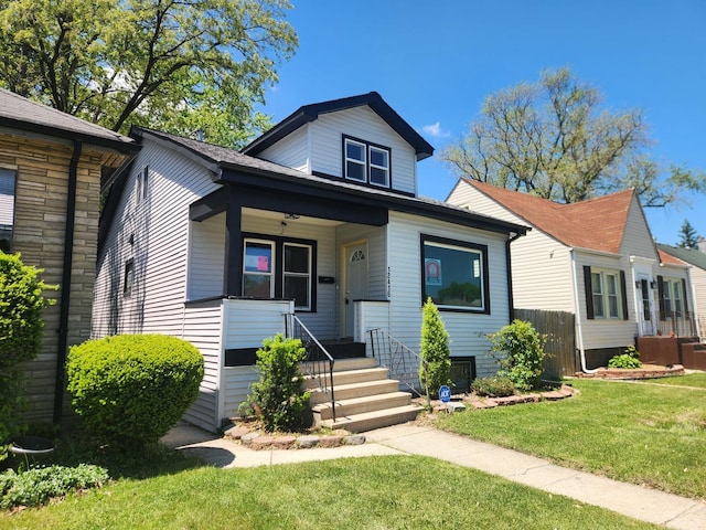 12416 S Carpenter St, Calumet Park, IL 60827 - bungalow featuring a front yard and a porch