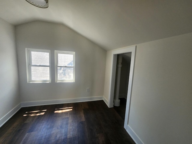 12416 S Carpenter St, Calumet Park, IL 60827 - additional living space with dark wood-style flooring, vaulted ceiling, and baseboards