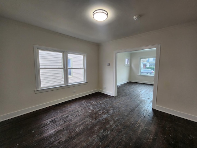 12416 S Carpenter St, Calumet Park, IL 60827 - spare room with crown molding, dark wood-style flooring, a smoke detector, and baseboards