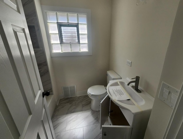 12416 S Carpenter St, Calumet Park, IL 60827 - bathroom featuring toilet, vanity, marble look tiles, and baseboards