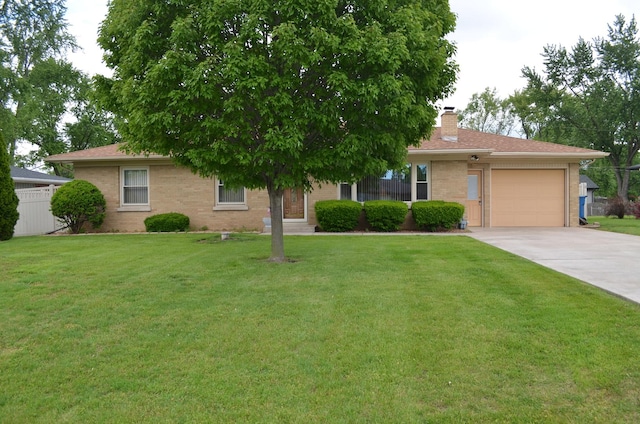 3127 Jo Ann Dr, Joliet, IL 60431 - view of front of house with an attached garage, driveway, a chimney, and brick siding