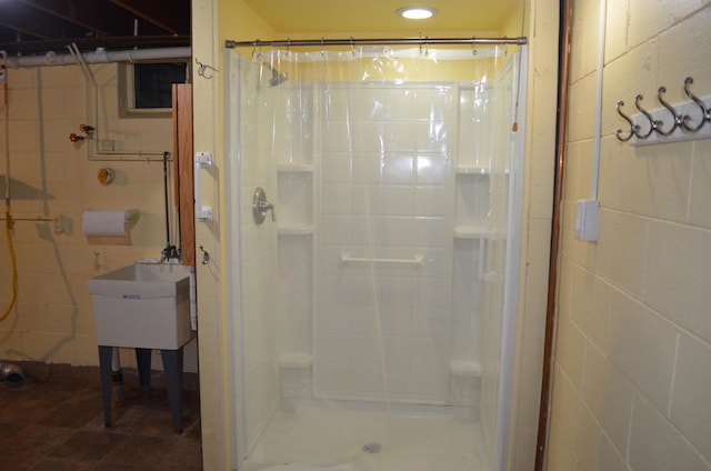 3127 Jo Ann Dr, Joliet, IL 60431 - bathroom featuring a stall shower and concrete block wall
