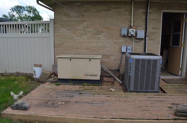 3127 Jo Ann Dr, Joliet, IL 60431 - exterior view of central air condition unit, a power unit, and brick siding