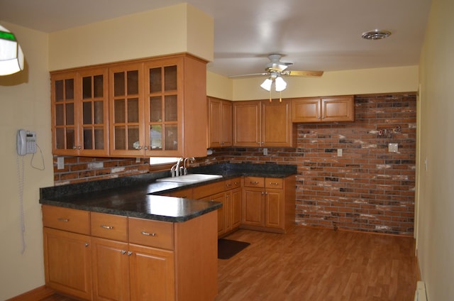 3127 Jo Ann Dr, Joliet, IL 60431 - kitchen featuring a sink, light wood finished floors, glass insert cabinets, a peninsula, and ceiling fan
