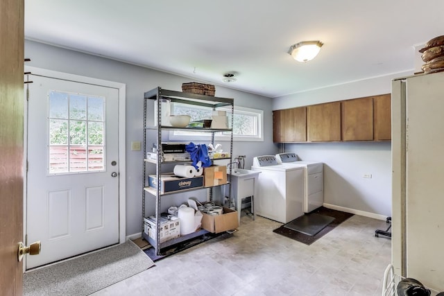3205 Meadow Dr, Rolling Meadows, IL 60008 - laundry room with cabinet space, washing machine and clothes dryer, baseboards, and light flooring