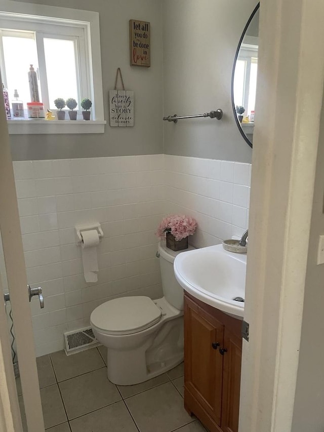 549 E Lincoln St Unit 549, Mount Prospect, IL 60056 - half bathroom with tile walls, plenty of natural light, toilet, tile patterned floors, and vanity