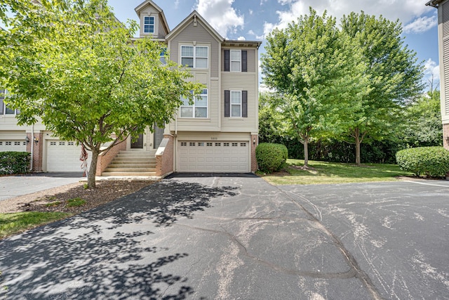 3355 Kentshire Cir, Aurora, IL 60504 - view of property with brick siding, driveway, and an attached garage