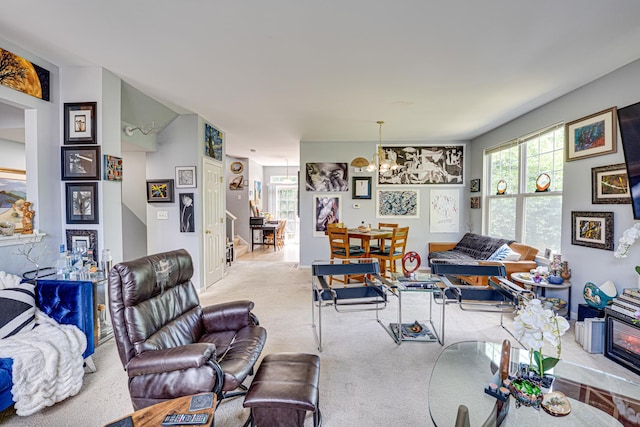 3355 Kentshire Cir, Aurora, IL 60504 - carpeted living area with a chandelier and healthy amount of natural light