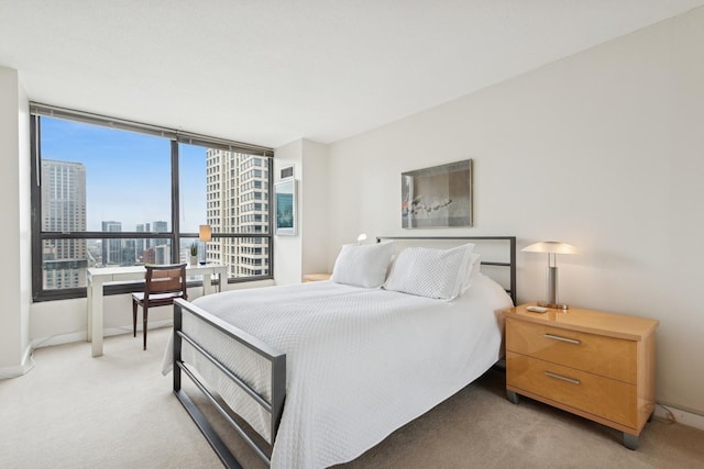 405 N Wabash Ave Unit 3103, Chicago, IL 60611 - bedroom featuring a city view, baseboards, and light carpet