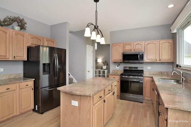 2012 Spring Creek Ln, Mchenry, IL 60050 - kitchen featuring appliances with stainless steel finishes, light brown cabinetry, a sink, light wood-type flooring, and light stone counters