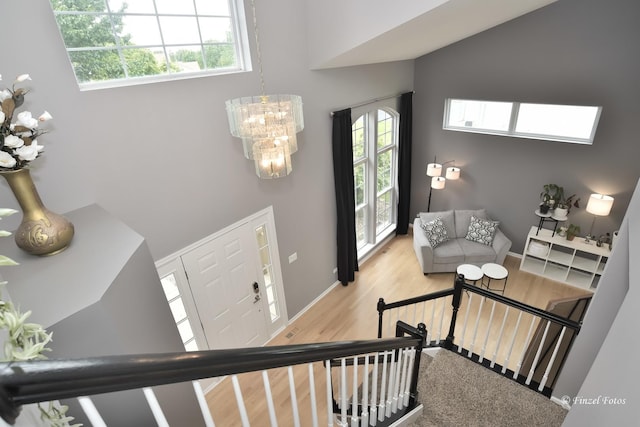 2012 Spring Creek Ln, Mchenry, IL 60050 - entryway featuring a chandelier, wood finished floors, baseboards, and a towering ceiling