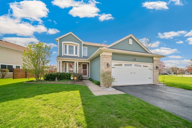 1282 Berkshire Ln, Grayslake, IL 60030 - traditional home featuring asphalt driveway, brick siding, and a garage