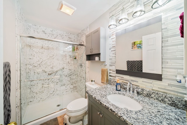 1282 Berkshire Ln, Grayslake, IL 60030 - full bathroom featuring a stall shower, backsplash, vanity, and toilet