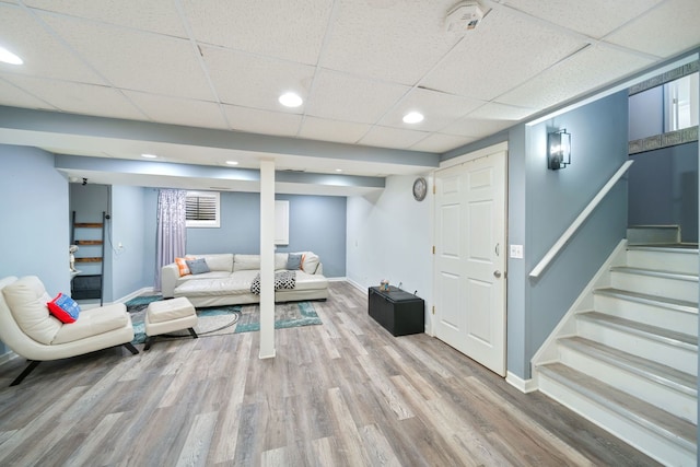 1282 Berkshire Ln, Grayslake, IL 60030 - living room with wood finished floors, baseboards, a drop ceiling, stairs, and recessed lighting