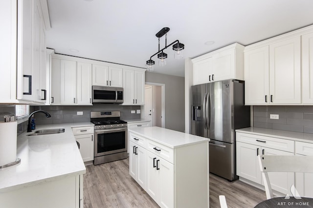 3365 Charlemaine Dr, Aurora, IL 60504 - kitchen with stainless steel appliances, a sink, tasteful backsplash, and white cabinetry