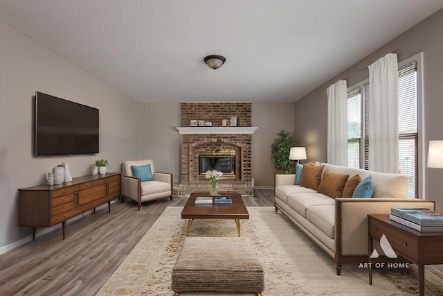3365 Charlemaine Dr, Aurora, IL 60504 - living room featuring wood finished floors, a brick fireplace, and baseboards