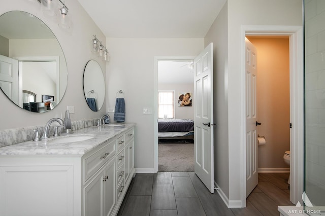 3365 Charlemaine Dr, Aurora, IL 60504 - ensuite bathroom featuring double vanity, toilet, and baseboards