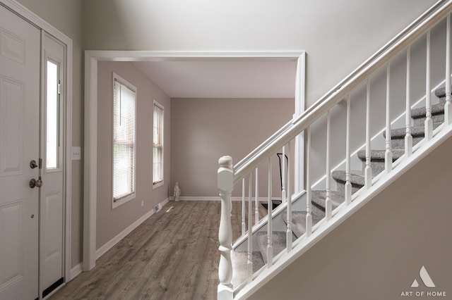 3365 Charlemaine Dr, Aurora, IL 60504 - entryway featuring wood finished floors, stairway, and baseboards