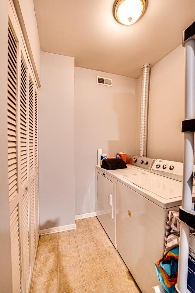 3379 Kentshire Cir, Aurora, IL 60504 - washroom with washer and dryer and light tile patterned flooring