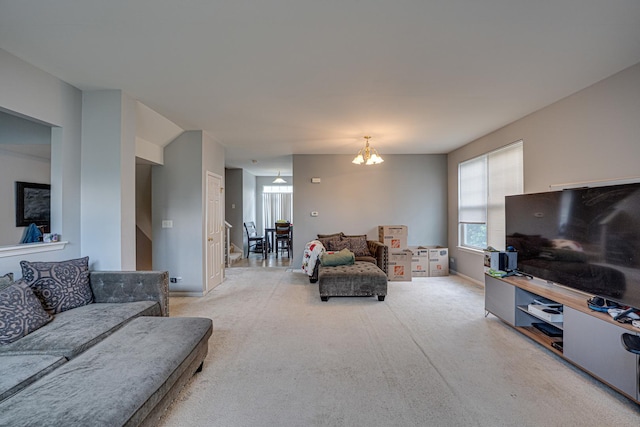 3379 Kentshire Cir, Aurora, IL 60504 - carpeted living room with baseboards and a chandelier