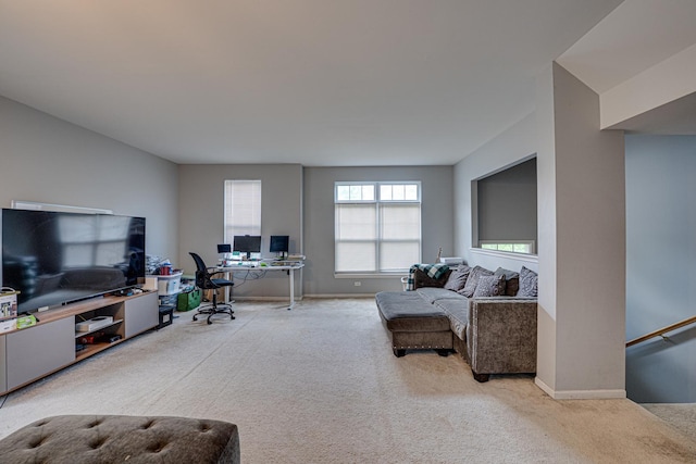 3379 Kentshire Cir, Aurora, IL 60504 - carpeted living room featuring a desk and baseboards