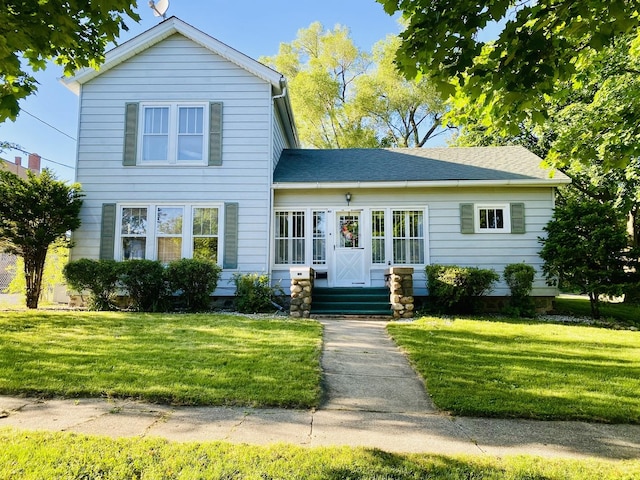 106 Dewey St, Harvard, IL 60033 - traditional-style home with a front lawn