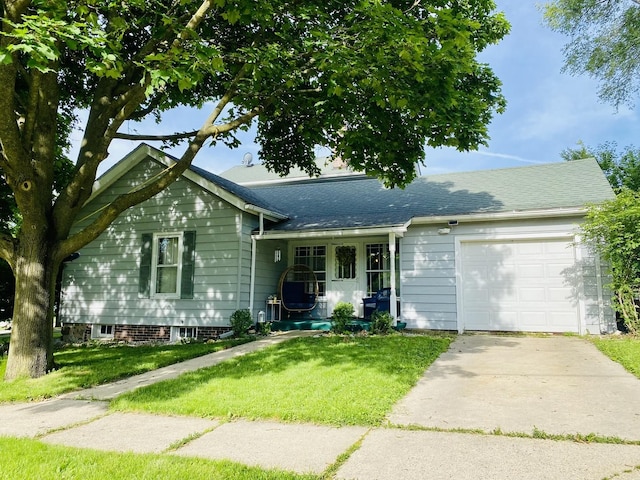 106 Dewey St, Harvard, IL 60033 - ranch-style house featuring a garage, concrete driveway, a front yard, and roof with shingles