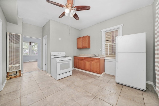 5014 S Paulina St, Chicago, IL 60609 - kitchen featuring white appliances, a heating unit, a sink, a ceiling fan, and a baseboard heating unit