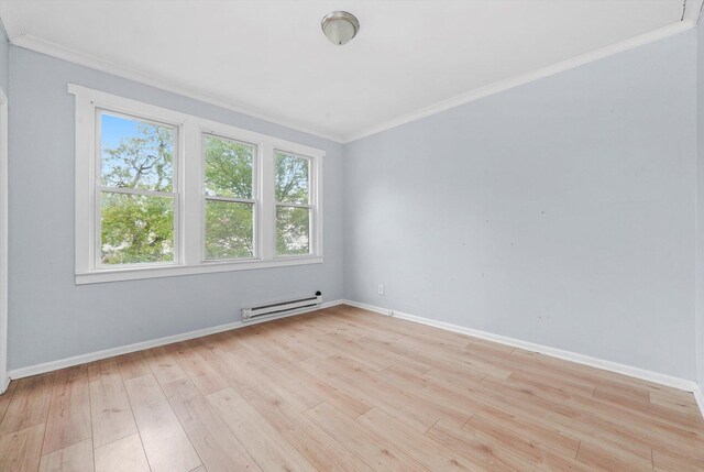 5014 S Paulina St, Chicago, IL 60609 - unfurnished room featuring baseboard heating, crown molding, light wood-style flooring, and baseboards