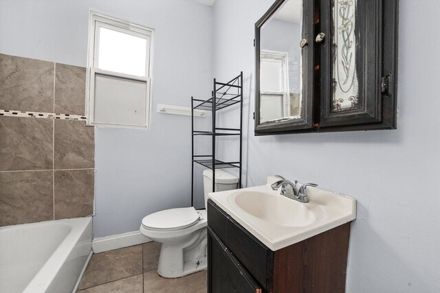 5014 S Paulina St, Chicago, IL 60609 - bathroom with vanity, toilet, baseboards, and tile patterned flooring