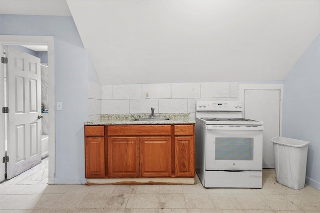 5014 S Paulina St, Chicago, IL 60609 - kitchen with white electric range oven, a sink, vaulted ceiling, brown cabinets, and light stone countertops