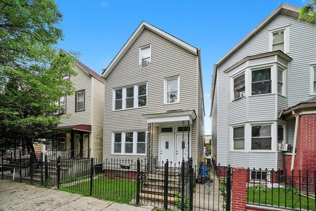 5014 S Paulina St, Chicago, IL 60609 - traditional-style home with a gate and a fenced front yard