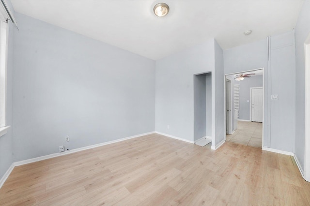 5014 S Paulina St, Chicago, IL 60609 - empty room featuring light wood-style floors, a ceiling fan, and baseboards