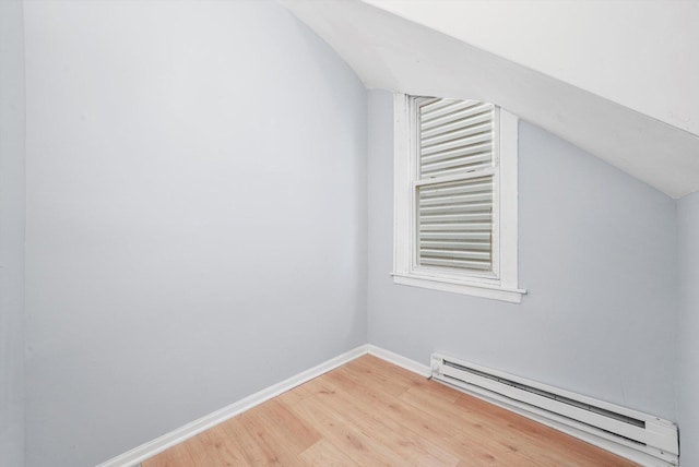 5014 S Paulina St, Chicago, IL 60609 - bonus room with a baseboard radiator, light wood-type flooring, vaulted ceiling, and baseboards