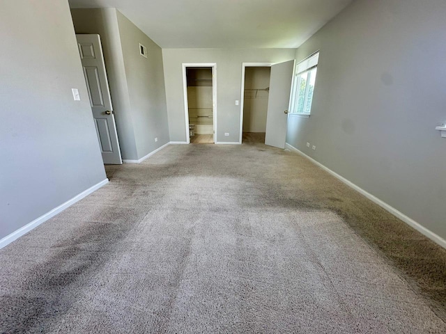 1458 Woodland Dr, South Elgin, IL 60177 - unfurnished bedroom with carpet floors, baseboards, a spacious closet, ensuite bath, and a closet