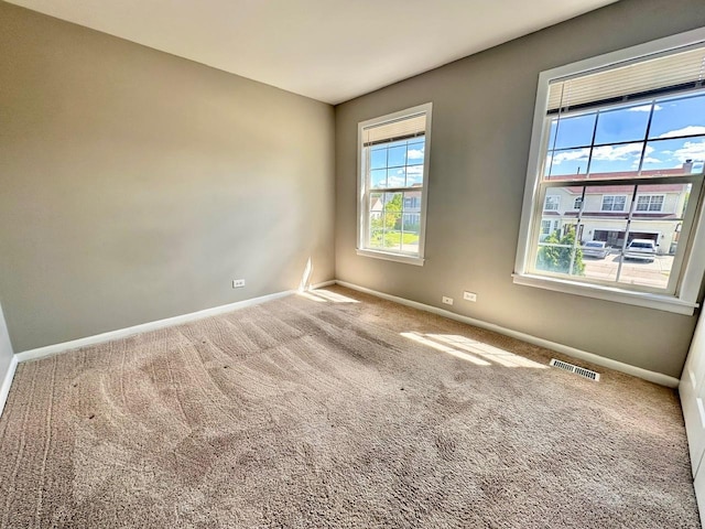 1458 Woodland Dr, South Elgin, IL 60177 - spare room featuring baseboards and carpet flooring