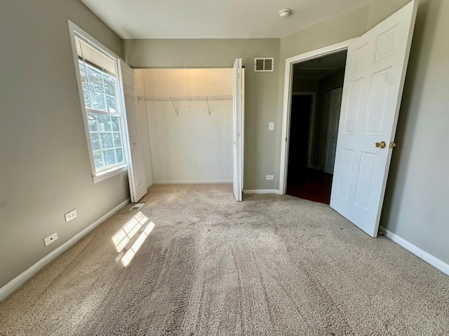 1458 Woodland Dr, South Elgin, IL 60177 - unfurnished bedroom with carpet flooring, baseboards, and a closet