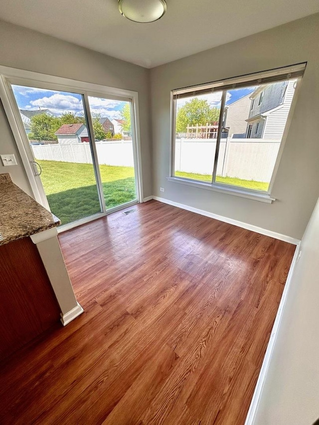1458 Woodland Dr, South Elgin, IL 60177 - unfurnished dining area with wood finished floors and baseboards