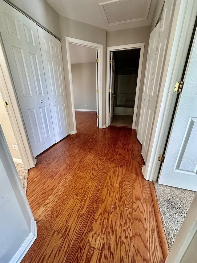 1458 Woodland Dr, South Elgin, IL 60177 - hall with attic access, wood finished floors, and baseboards