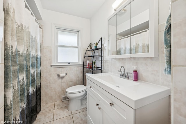 5513 Mulford St, Skokie, IL 60077 - bathroom featuring tile walls, vanity, tile patterned floors, toilet, and a shower with curtain