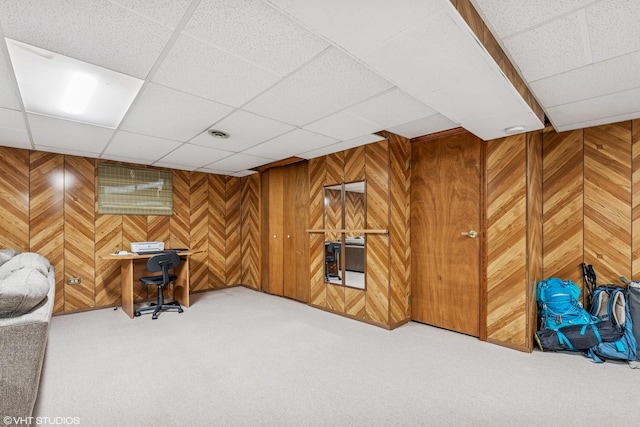 5513 Mulford St, Skokie, IL 60077 - living area with a drop ceiling, carpet, wooden walls, and an office area