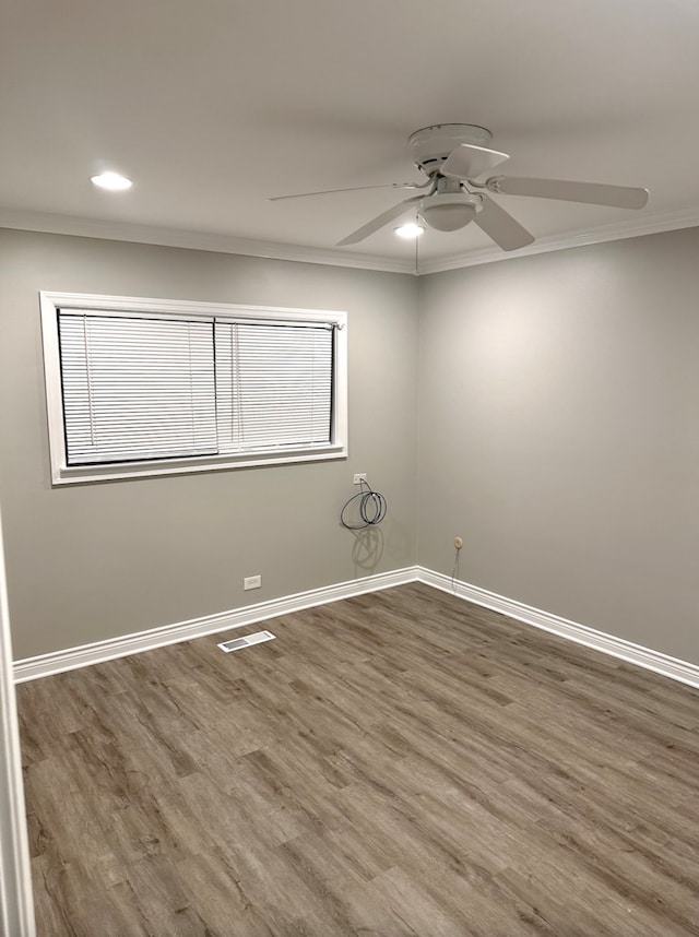 501 E Prospect Ave Unit 1F, Mount Prospect, IL 60056 - unfurnished room featuring ornamental molding, wood finished floors, a ceiling fan, baseboards, and recessed lighting