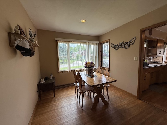 612 S 1st Ave, Forreston, IL 61030 - dining room with wood finished floors and baseboards