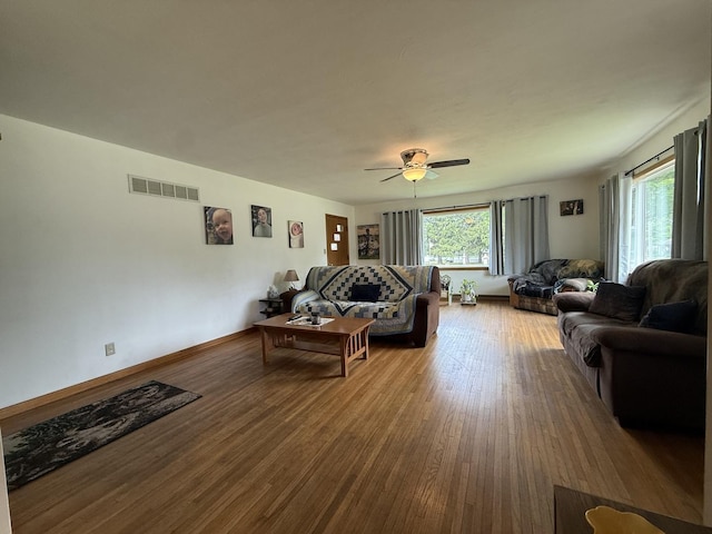 612 S 1st Ave, Forreston, IL 61030 - living area featuring wood finished floors and a ceiling fan