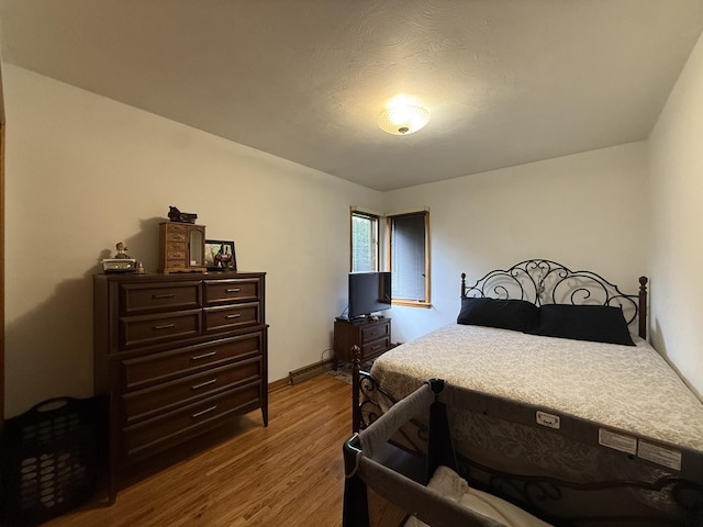 612 S 1st Ave, Forreston, IL 61030 - bedroom with dark wood-type flooring and baseboards