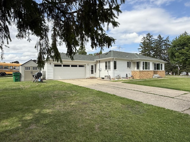 612 S 1st Ave, Forreston, IL 61030 - ranch-style house with an attached garage, concrete driveway, and a front yard
