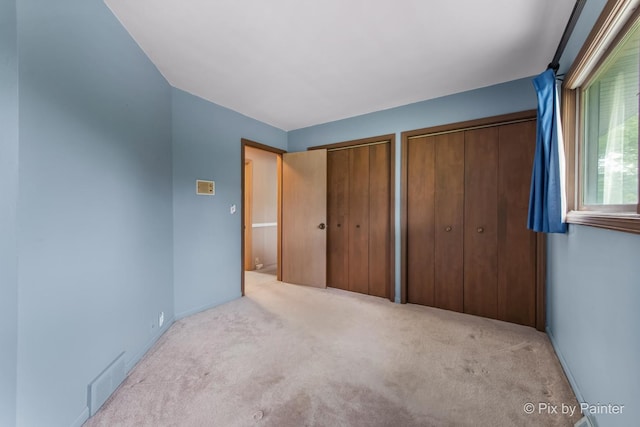5 Canterbury Ct, South Barrington, IL 60010 - unfurnished bedroom featuring carpet, multiple closets, and baseboards
