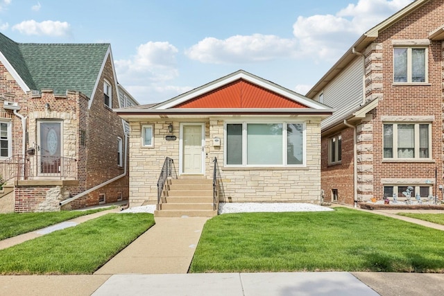 3220 N Nottingham Ave, Chicago, IL 60634 - view of front of home with stone siding and a front yard