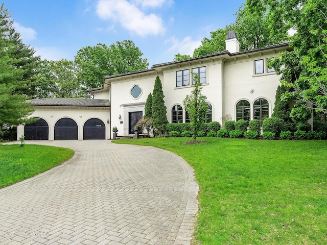 11315 77th St, Burr Ridge, IL 60527 - mediterranean / spanish-style home featuring curved driveway, an attached garage, a front yard, a chimney, and stucco siding